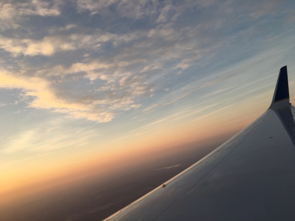 plane flying over the clouds