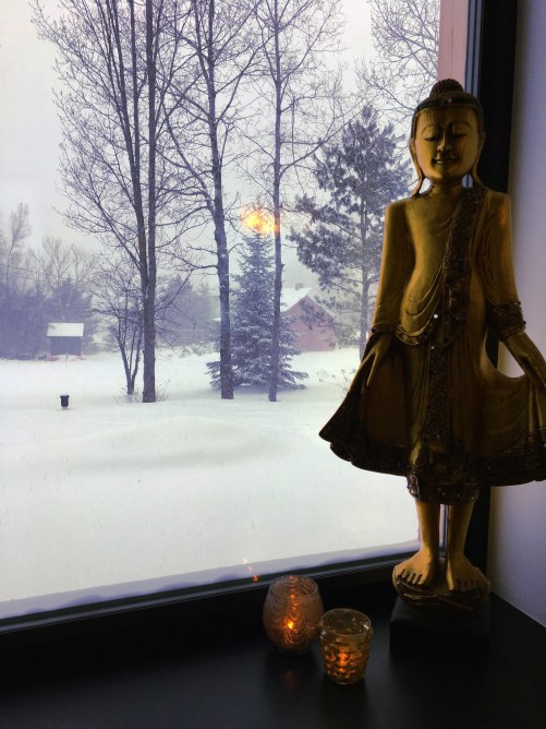 Buddha in the Window during a snow storm