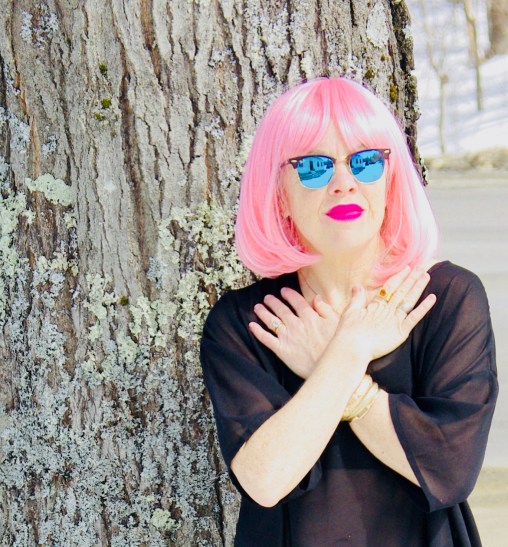 bold pink lipstick and wig on model