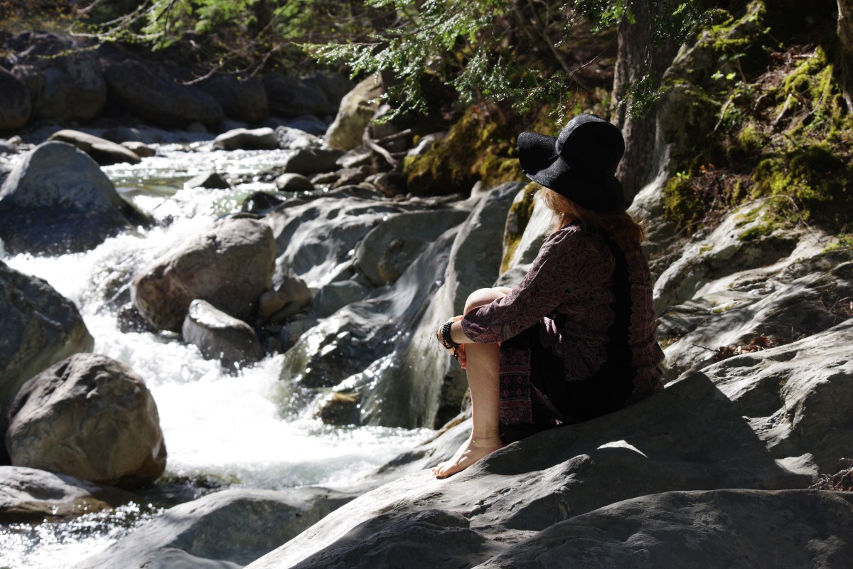 sitting next to the river