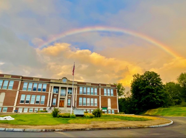 rainbow over a school building
