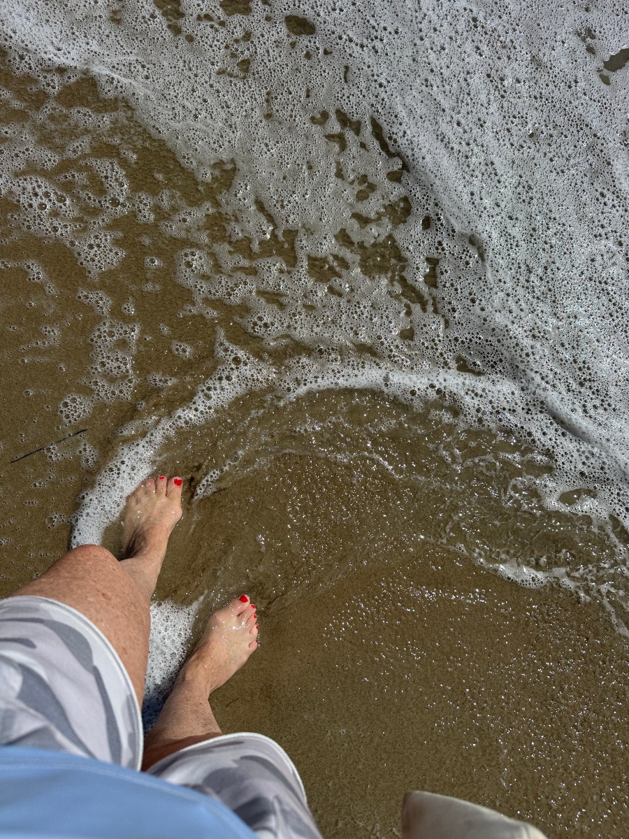 feet walking in the surf
