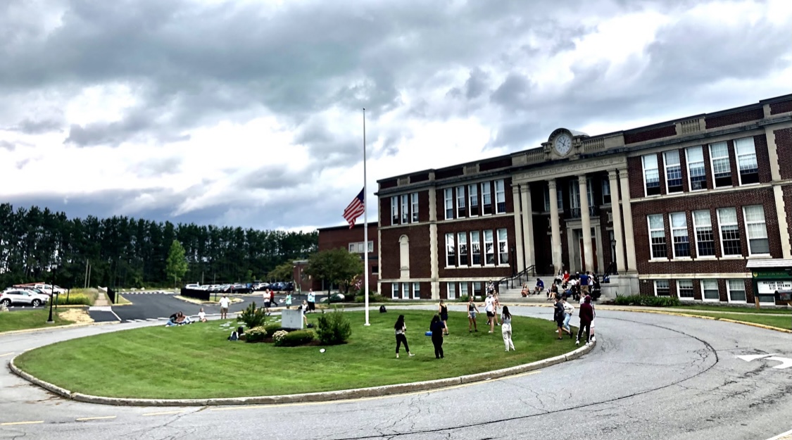 school with flag at half mast