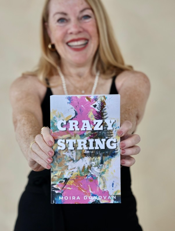 This author holding her book, Crazy String