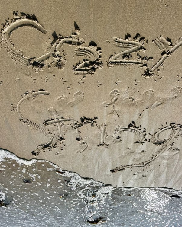 Crazy String written in the sand
