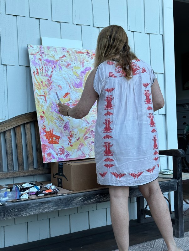 woman painting outside